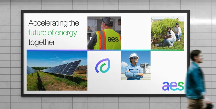 Billboard in a subway station displays 'Accelerating the future of energy, together' with images of solar panels, workers in safety gear, people planting greenery, and the AES logo, promoting sustainable energy and teamwork.